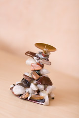 Decorative candlestick on a wooden shelf