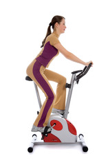 Attractive woman doing fitness on a stationary bike