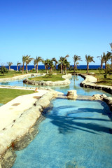 Brook, current from pool in pool.Resort in hotel Makadi bay.