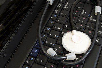 Stethoscope over laptop keyboard
