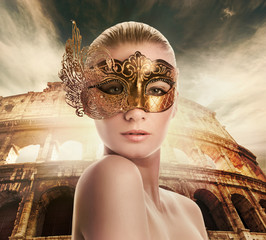 Naklejka na ściany i meble Beautiful woman in front of Colosseum (Rome, Italy)