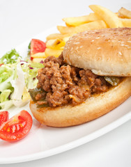 minced meat burger with salad and fries