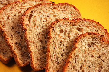 Bread slices on yellow background