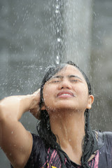 Portrait Of Woman Shower in Water Splash Outdoor