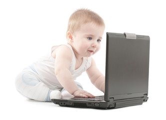 Surprised baby boy express working on laptop