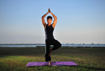 Fototapeta premium Yoga By The Beach