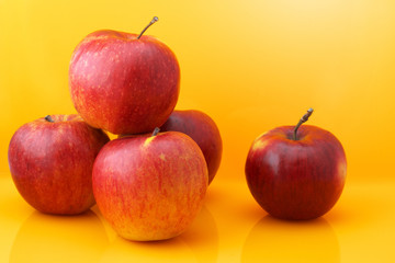 Apples on yellow