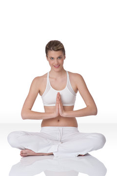 Smiling woman in yoga position