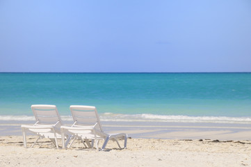 Two chairs on tropical beach