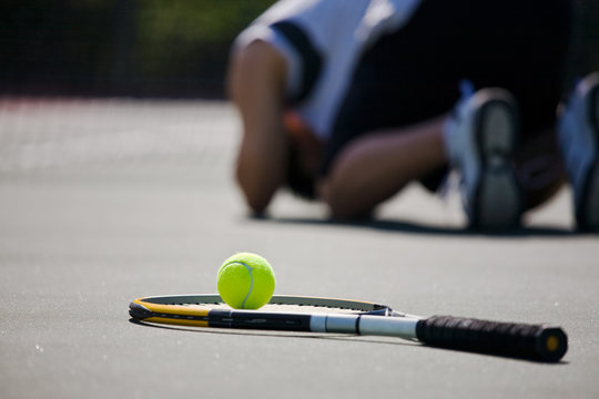 Sad tennis player after defeat