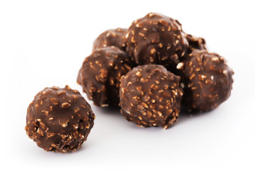 Chocolates with nut on white background