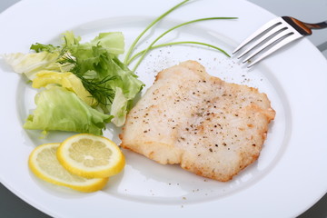 Fish dish - roasted cod with vegetable salad