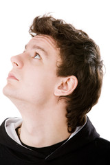 Close-up portrait of man looking into the upper left corner