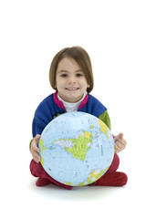 Little girl embracing the world globe isolated on white