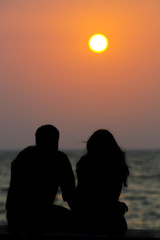 Couple watching a sun set