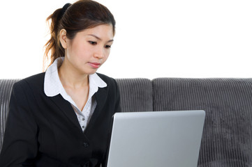 Asian businesswoman working on her laptop