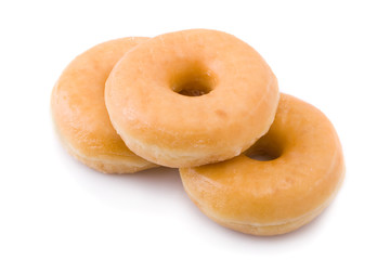 Three doughnuts or donuts piled isolated on white