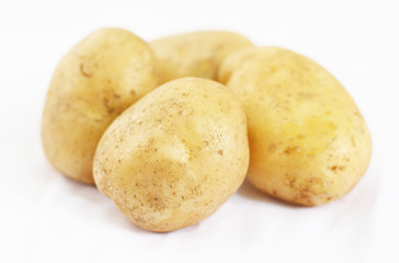 Close up of Four Potato on White Background