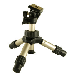 A photographers mini tripod isolated over a white background