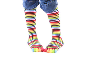 woman legs in strip sock on white background