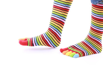 woman legs in strip sock on white background
