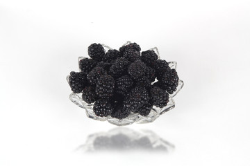 Blackberries on white with reflection