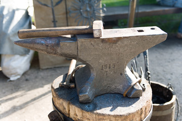Old metal anvil and mallet