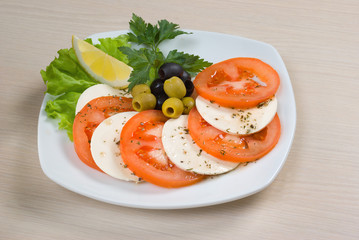 Arrangement of mozzarella and tomatoes