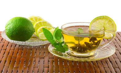 Cup of green tea with mint and lime