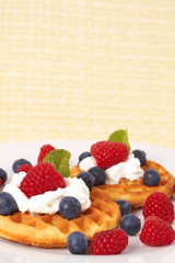 Belgian waffles with berries and cream