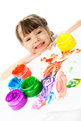 Fototapeta na wymiar happy girl painting with finger paints