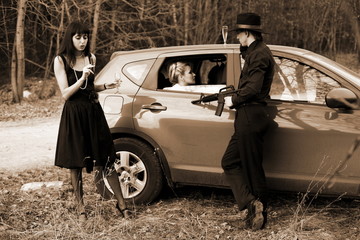 brunette , man and woman with cigar, wine in car
