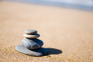 Fototapeta na wymiar stones stacked up on beach