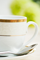 coffee cup and green flower