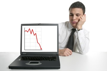 Businessman with laptop computer, bad news