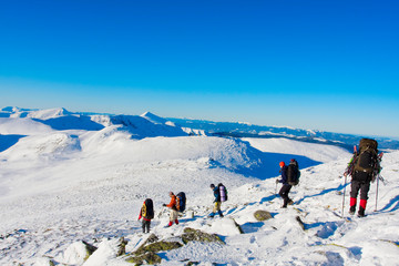 Hiker are in winter in mountains