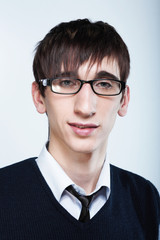 cute young guy with fashion haircut wearing glasses