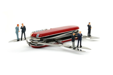business people on penknife