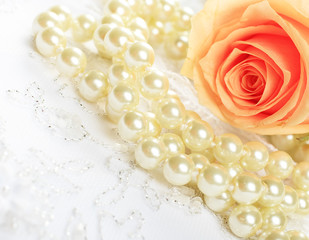 Textile wedding background with  rose and pearls