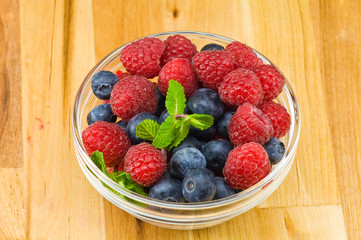 Blueberry, ruspberry and mint leaves