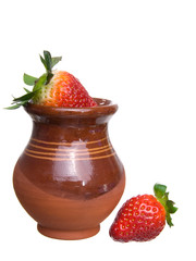 Fresh ripe strawberries in jug
