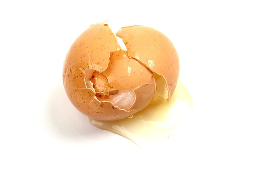 Cracked broken egg shell raw leaking ingredient white background accident disaster accidnt