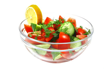 raw vegetable salad in bowl over white