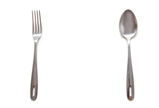 spoon and fork over white