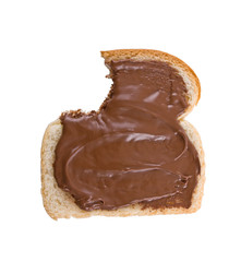 Bitten slice of bread covered with Hazelnut and chocolate spread