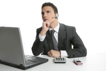 Businessman with headphones and laptop