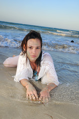Wet woman in the sand