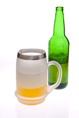 Beer mug and bottle on white background
