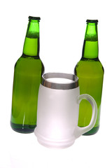 Beer mug and bottle on white background