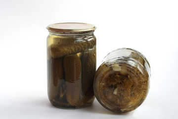 Cup of canned cucumbers. Isolated on a white background